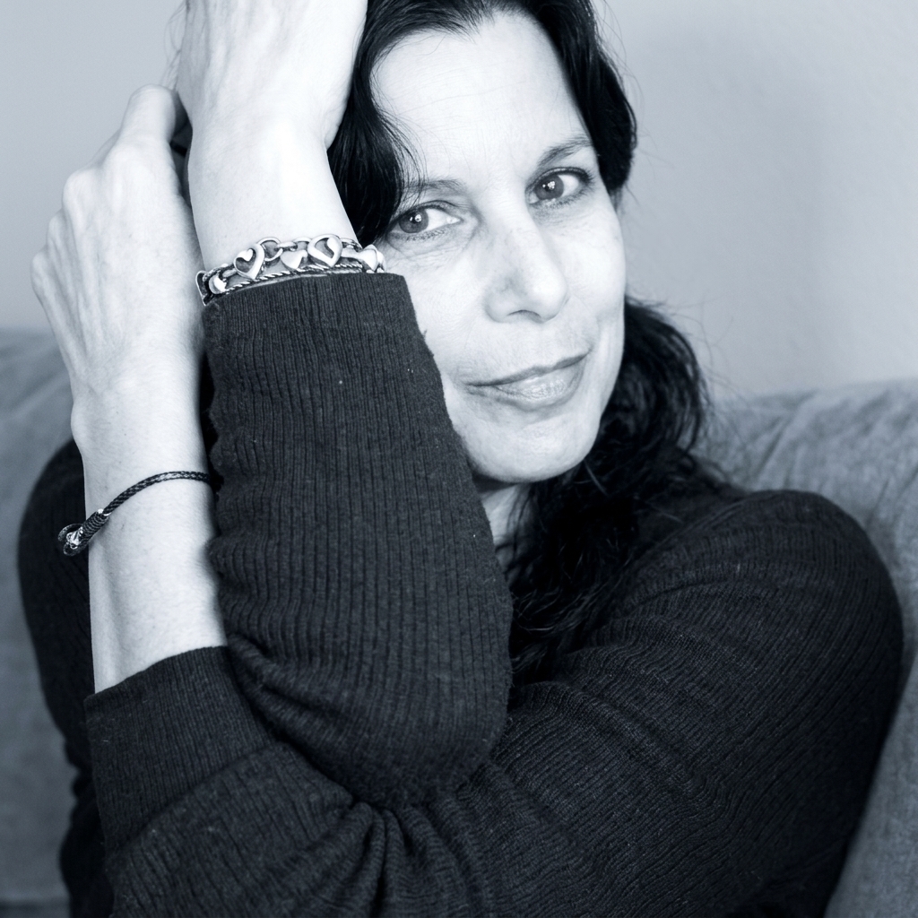 Portrait photo of artist Natty Saidi in her Vancouver studio